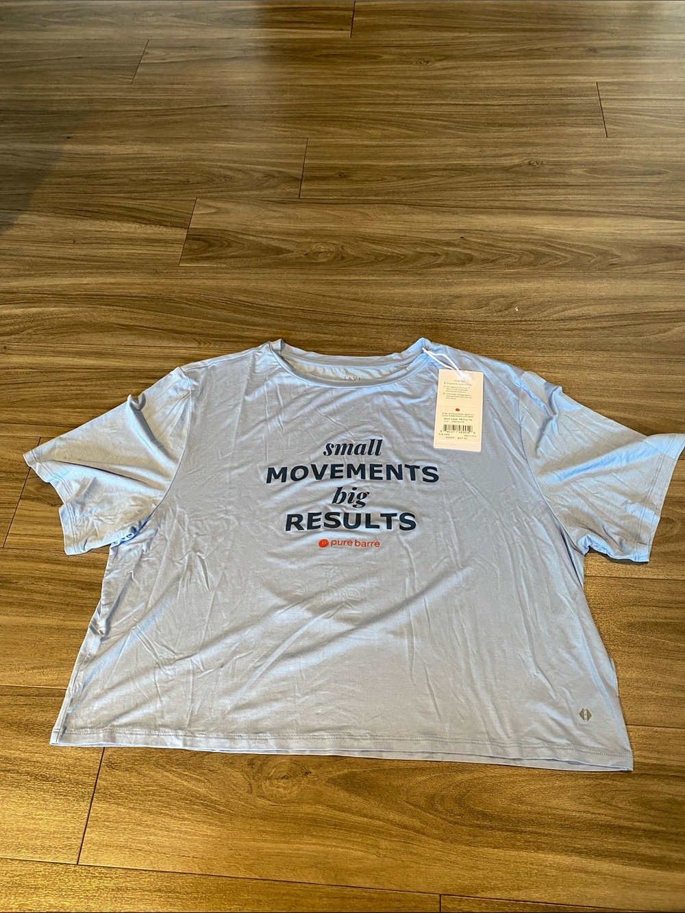 Pure Barre Light Blue Graphic Crop Tee - 'Small Movements Big Results'